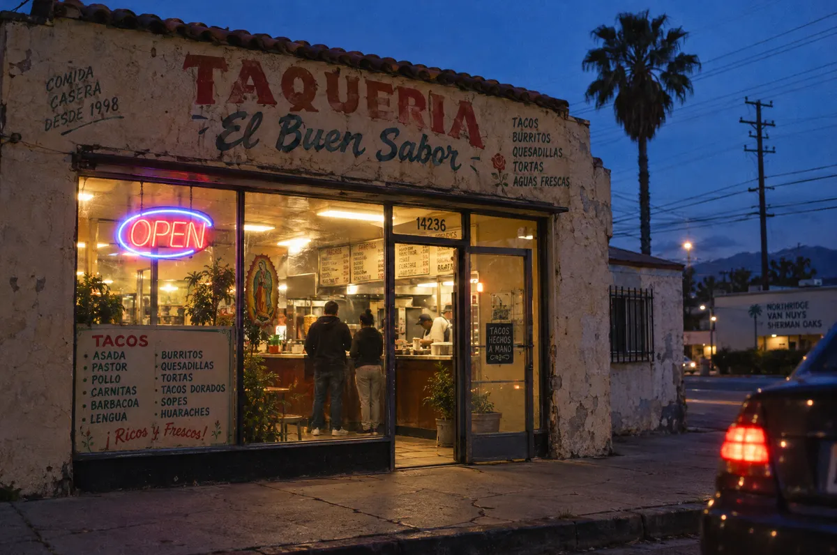 Family-owned taqueria on a San Fernando Valley boulevard at blue hour with a neon open sign